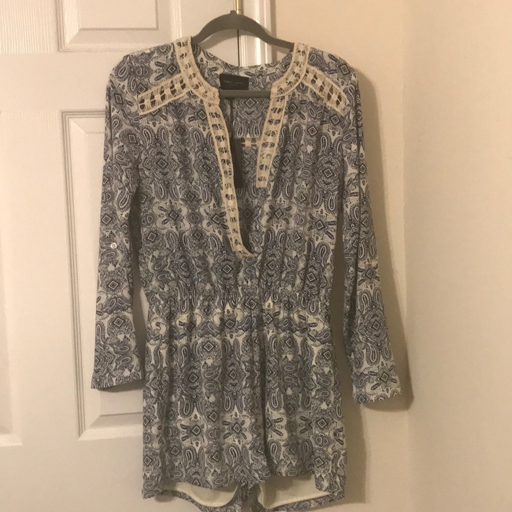 Long sleeve romper “new” with tags never worn.